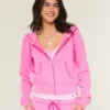 Sudadera con capucha y cremallera de felpa