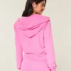 Sudadera con capucha y cremallera de felpa