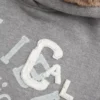 Sudadera con capucha y estampado gráfico con forro de piel sintética