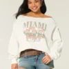 Sudadera gráfica Miami con hombros descubiertos y doble confección