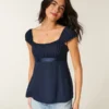 Top babydoll con lazo de satén