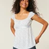 Top babydoll con lazo de satén