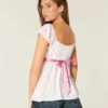 Top babydoll con lazo de satén