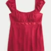 Top babydoll con lazo de satén