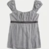 Top babydoll con lazo de satén