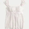 Top babydoll con lazo de satén