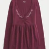 Top babydoll de manga larga con pinzas en el pecho