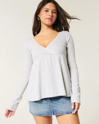 Top babydoll de manga larga con punto calado