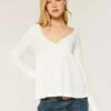 Top babydoll de manga larga con punto calado