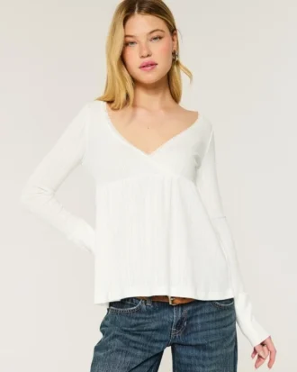 Top babydoll de manga larga con punto calado