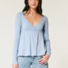 Top babydoll de manga larga con punto calado