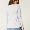 Top babydoll de manga larga con punto calado
