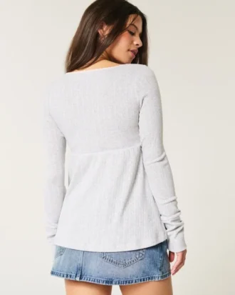 Top babydoll de manga larga con punto calado