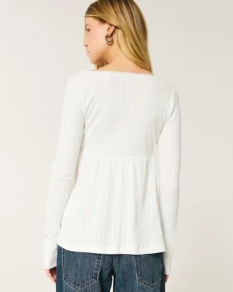 Top babydoll de manga larga con punto calado