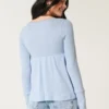 Top babydoll de manga larga con punto calado