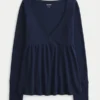 Top babydoll de manga larga con punto calado