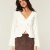 Top babydoll de manga larga con volantes