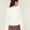 Top babydoll de manga larga con volantes