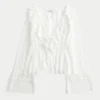 Top babydoll de manga larga con volantes