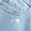 Vaqueros bootcut de talle bajo con bordado de estrellas