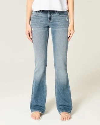 Vaqueros bootcut de talle bajo, lavado medio y efecto desgastado