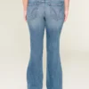 Vaqueros bootcut de talle bajo, lavado medio y rotos