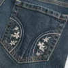 Vaqueros bootcut de talle bajo, lavado oscuro y bordados Vaqueros bootcut de talle bajo, lavado oscuro y bordados
