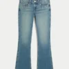 Vaqueros bootcut de talle bajo y lavado medio con tachuelas