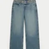 Vaqueros holgados con cintura bordada, lavado medio y talle ultra bajo Vaqueros holgados con cintura bordada, lavado medio y talle ultra bajo
