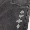 Vaqueros holgados de skater con estampado de joker de naipes lavados en negro