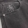 Vaqueros holgados de skater con estampado de joker de naipes lavados en negro