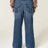 Vaqueros holgados de talle bajo y lavado oscuro con cintura ajustable Vaqueros holgados de talle bajo y lavado oscuro con cintura ajustable