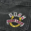 Vaqueros holgados skater con bordado «Good Luck» en negro lavado