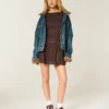 Vestido con falda pantalón, cuello alto y cintura baja