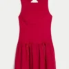 Vestido con falda pantalón, cuello alto y cintura baja