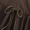 Vestido con falda pantalón, cuello alto y cintura baja