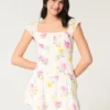 Vestido con falda pantalón y mangas con volantes
