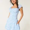 Vestido con falda pantalón y mangas con volantes