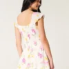 Vestido con falda pantalón y mangas con volantes