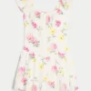 Vestido con falda pantalón y mangas con volantes