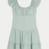 Vestido con falda pantalón y mangas con volantes